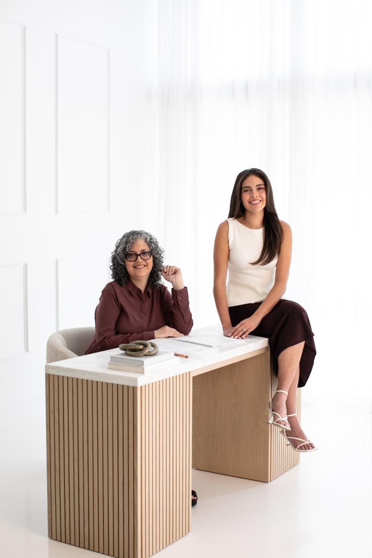 Maria Del Sol and Emily Eidam at the EmClosings desk